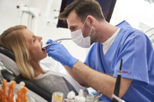 focused stomatologist using dental drill and denta 2023 11 27 04 56 49 utc